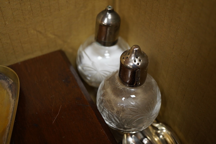 A cased set of twelve pairs of mother of pearl handled plated dessert eaters and a quantity of assorted plated items including a toastrack, a pair of mounted glass condiments, crumb scoop and miscellaneous flatware.